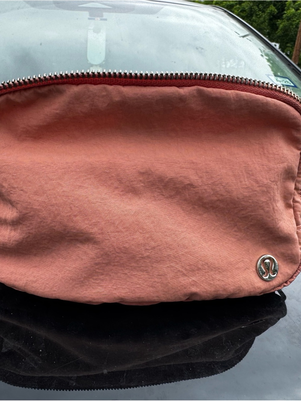 lululemon coral pink zip pouch with metal logo plate